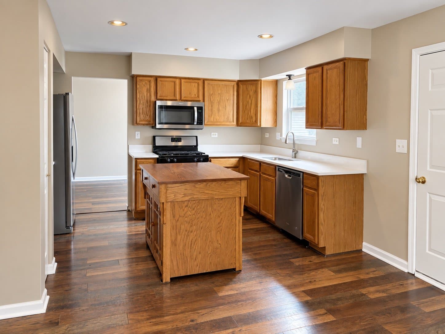 Kitchen with stainless appliances and new flooring (2026)